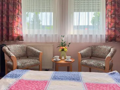 Ein Sitzbereich in der Unterkunft Hotel DenRiKo