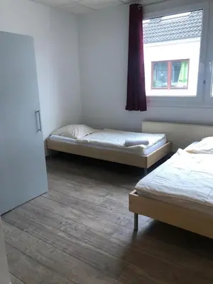 Ein Bett oder Betten in einem Zimmer der Unterkunft Pension Gästehaus Kautz