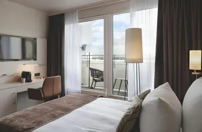 Ein Bett oder Betten in einem Zimmer der Unterkunft Leonardo Hotel Heidelberg City Center