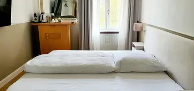 Ein Bett oder Betten in einem Zimmer der Unterkunft gemütliches Privatzimmer in Mannheims Stadtmitte