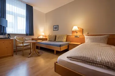 Ein Bett oder Betten in einem Zimmer der Unterkunft Gasthof zur Krone