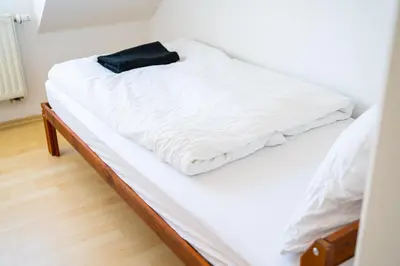 Ein Bett oder Betten in einem Zimmer der Unterkunft 153 m² Haus mit 6 Schlafzimmern für 12 Persoen