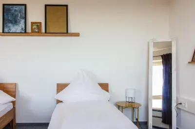 Ein Bett oder Betten in einem Zimmer der Unterkunft Private Rooms Karlsruhe near station