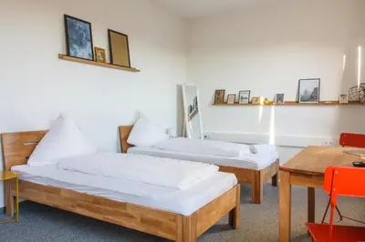 Ein Bett oder Betten in einem Zimmer der Unterkunft Private Rooms Karlsruhe near station