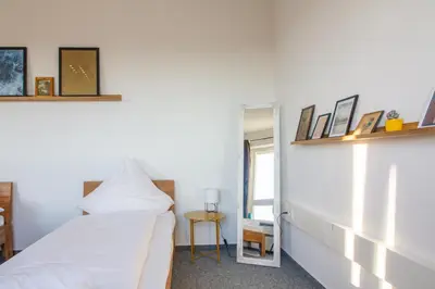 Ein Bett oder Betten in einem Zimmer der Unterkunft Private Rooms Karlsruhe near station