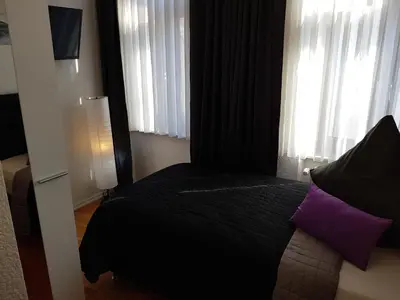 Ein Bett oder Betten in einem Zimmer der Unterkunft Hotel Exquisite