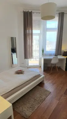 Ein Bett oder Betten in einem Zimmer der Unterkunft ApartInn