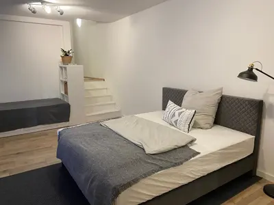 Ein Bett oder Betten in einem Zimmer der Unterkunft Apt6 - Ferienwohnung Brötzingen EG