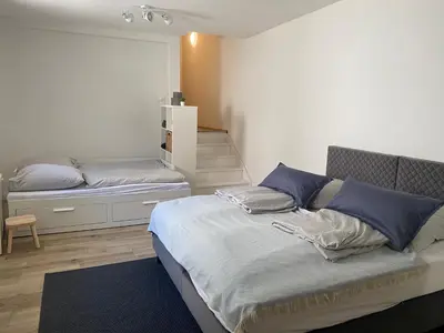 Ein Bett oder Betten in einem Zimmer der Unterkunft Apt6 - Ferienwohnung Brötzingen EG