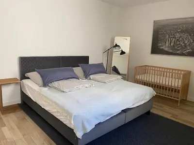 Ein Bett oder Betten in einem Zimmer der Unterkunft Apt6 - Ferienwohnung Brötzingen EG