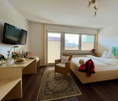 Ein Bett oder Betten in einem Zimmer der Unterkunft Hotel Pension Heidi