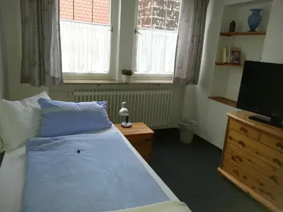 Ein Bett oder Betten in einem Zimmer der Unterkunft Hotel Blaues Haus