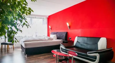 Ein Bett oder Betten in einem Zimmer der Unterkunft City Hotel Heilbronn