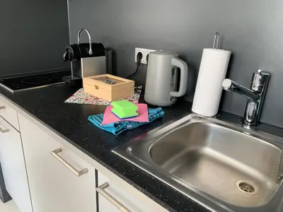Küche/Küchenzeile in der Unterkunft Gemütliches Apartment by Rabe - Parkplatz, Smart-TV, Netflix