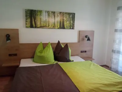Ein Bett oder Betten in einem Zimmer der Unterkunft Gasthof Zum Löwen