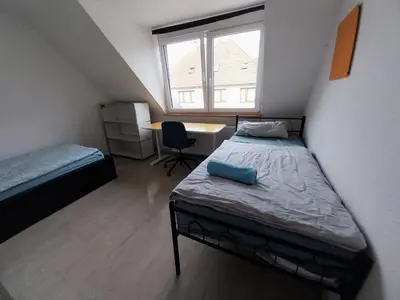 Ein Bett oder Betten in einem Zimmer der Unterkunft Monteurwohnung - Pforzheim Nordstadt - L8