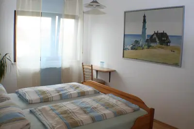 Ein Bett oder Betten in einem Zimmer der Unterkunft Pension und Weingut Hirschhof
