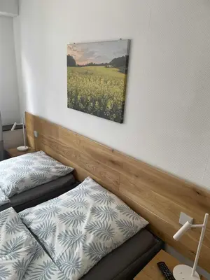 Ein Bett oder Betten in einem Zimmer der Unterkunft Gästehaus Jagsttal