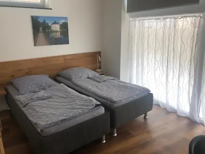 Ein Bett oder Betten in einem Zimmer der Unterkunft Gästehaus Jagsttal