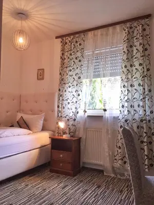 Ein Bett oder Betten in einem Zimmer der Unterkunft Hotel Attaché