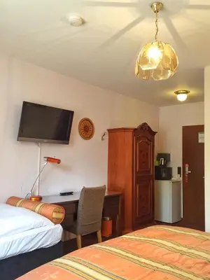 Ein Bett oder Betten in einem Zimmer der Unterkunft Hotel Attaché