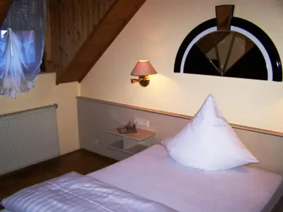 Ein Bett oder Betten in einem Zimmer der Unterkunft Gasthof Engel Steinbach