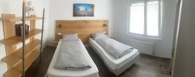 Ein Bett oder Betten in einem Zimmer der Unterkunft Ferienwohnung EG Heppenheim
