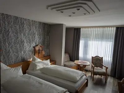 Ein Bett oder Betten in einem Zimmer der Unterkunft Hotel Odenwaldblick