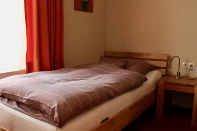 Ein Bett oder Betten in einem Zimmer der Unterkunft Hotel Donnersberg