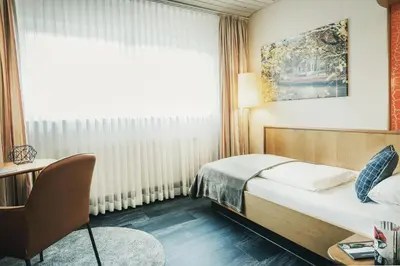 Ein Bett oder Betten in einem Zimmer der Unterkunft Hotel Koch