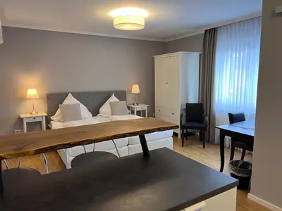 Ein Bett oder Betten in einem Zimmer der Unterkunft Hotel 'Zum Augarten'