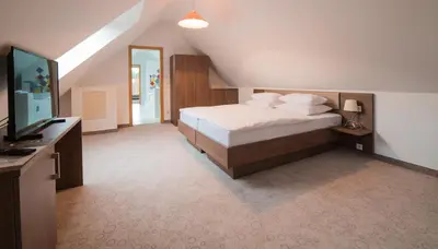 Ein Bett oder Betten in einem Zimmer der Unterkunft Hotel am Wasen