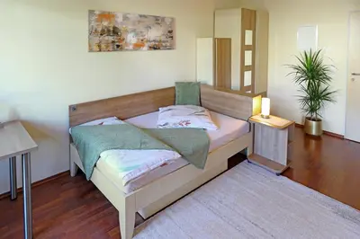 Ein Bett oder Betten in einem Zimmer der Unterkunft Boardinghouse am Rosensee