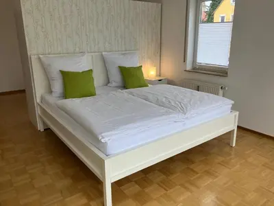Ein Bett oder Betten in einem Zimmer der Unterkunft Ferienwohnung-Ludwigsburg-City