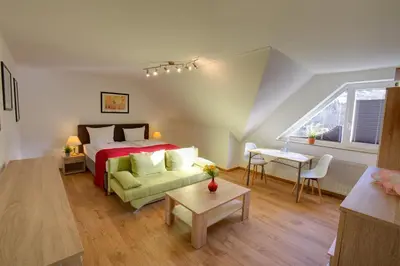 Ein Bett oder Betten in einem Zimmer der Unterkunft Hotel Leo Mühlhausen