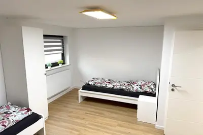 Ein Bett oder Betten in einem Zimmer der Unterkunft 4 Zimmer Ferienwohnung Egelsbach