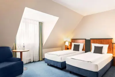 Ein Bett oder Betten in einem Zimmer der Unterkunft Amedia Frankfurt Russelsheim Trademark Collection by Wyndham