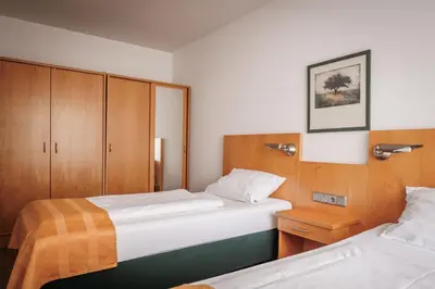 Ein Bett oder Betten in einem Zimmer der Unterkunft Ariva Boardinghouse Platanenhof