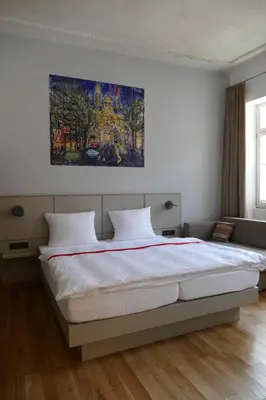 Ein Bett oder Betten in einem Zimmer der Unterkunft Maximilian