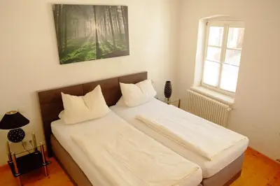 Ein Bett oder Betten in einem Zimmer der Unterkunft Ambiente Ferienwohnungen