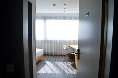 Ein Bett oder Betten in einem Zimmer der Unterkunft Cristall Hotel