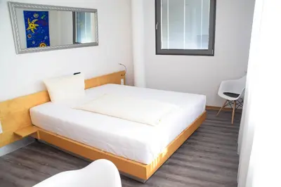 Ein Bett oder Betten in einem Zimmer der Unterkunft Cristall Hotel
