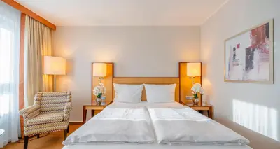 Ein Bett oder Betten in einem Zimmer der Unterkunft The Q - Quadro City Hotel