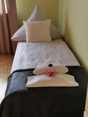 Ein Bett oder Betten in einem Zimmer der Unterkunft Hotel Mainperle