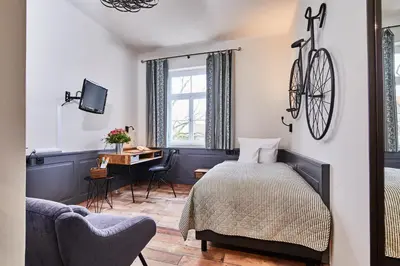 Ein Bett oder Betten in einem Zimmer der Unterkunft Hotel & Restaurant Grenzhof
