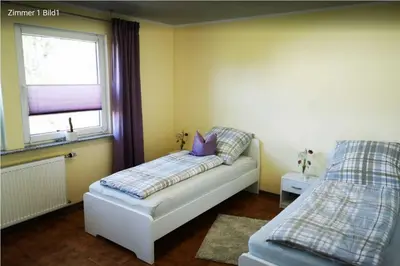 Ein Bett oder Betten in einem Zimmer der Unterkunft Birkenblick - Ferienwohnung Owwe