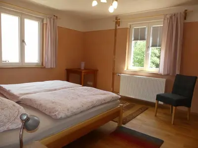 Ein Bett oder Betten in einem Zimmer der Unterkunft Ferienwohnungen Im grünen Eck