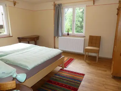 Ein Bett oder Betten in einem Zimmer der Unterkunft Ferienwohnungen Im grünen Eck