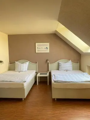 Ein Bett oder Betten in einem Zimmer der Unterkunft Hotel Weller