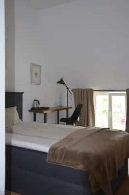 Ein Bett oder Betten in einem Zimmer der Unterkunft Wersauer Hof - Ferme Auberge